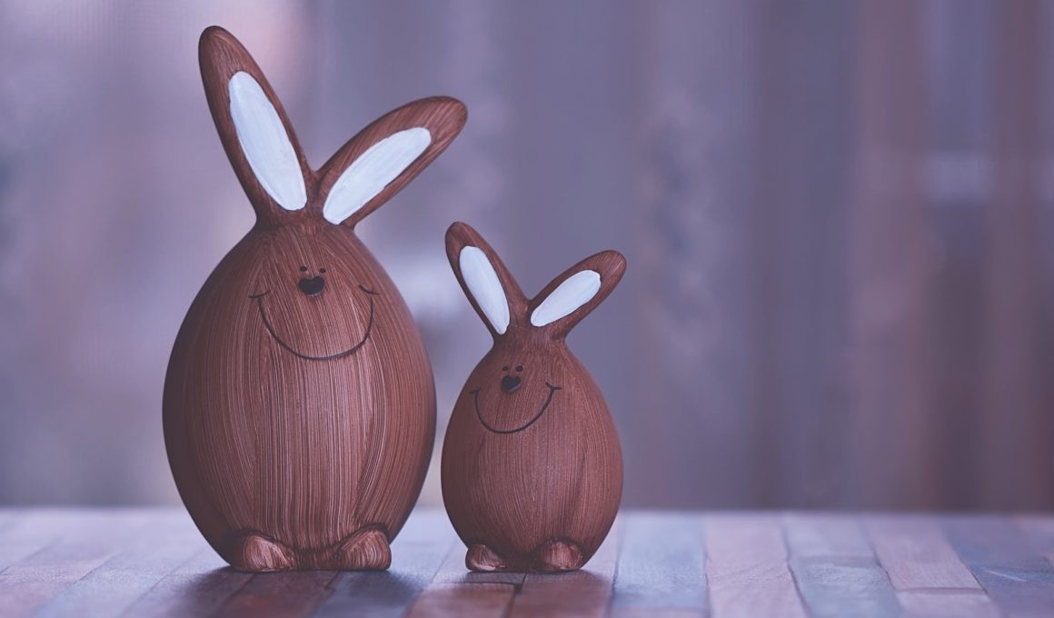 two brown and white rabbit figurines 2156261